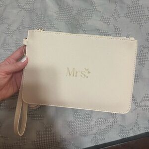 Elegant Cream Clutch with Gold Accents